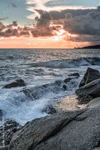 sunset clouds and waves on the island of elba