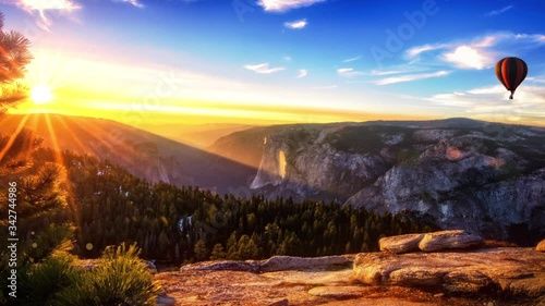 Parallax effect  in the mountains. flying hot air balloon.
Beautiful sunrise.