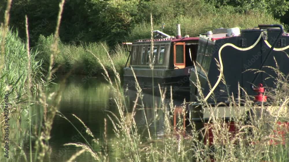 Narrowboat on a canal in England vacation UK Narrowboat on a canal in England vacation UK