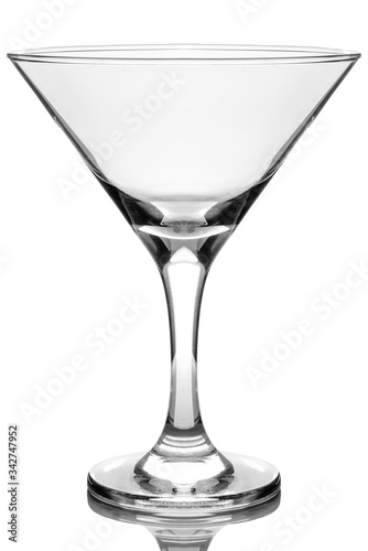 Martini glass on a white glossy background isolation