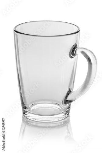 Glass mug on a white glossy background isolation