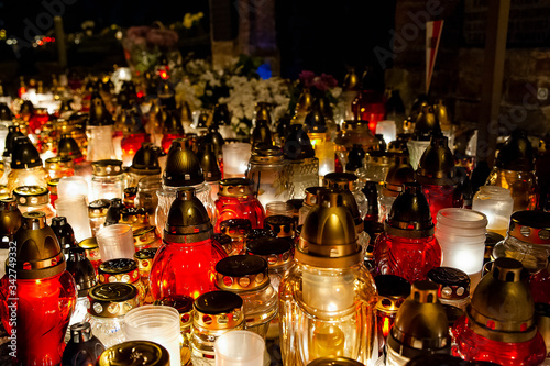 Candles burning at a cemetery. Polish tradition of commemorating deceased loved ones. 'All Saints Day' - November 1st