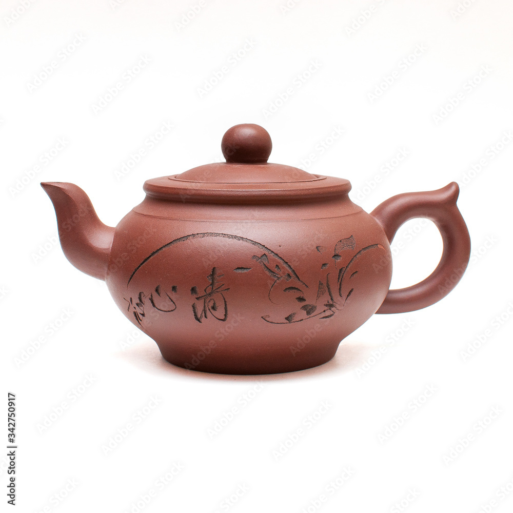 Clay Chinese teapot isolated on white