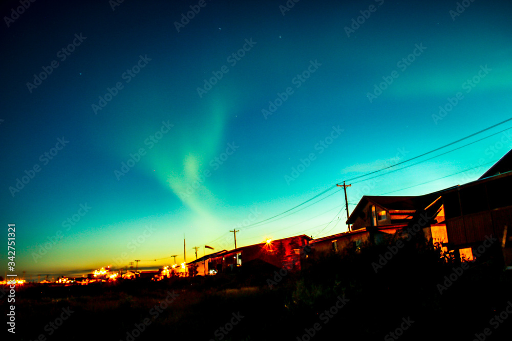 Northern lights dancing above the town of Churchill