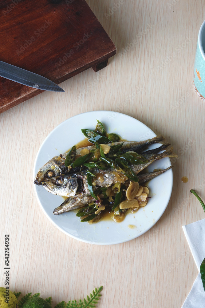 Spicy hot salted fish with bunch of green chili Spicy hot salted fish with bunch of green chili