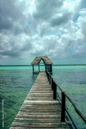 Thatched hut on the end of a pier in paradise