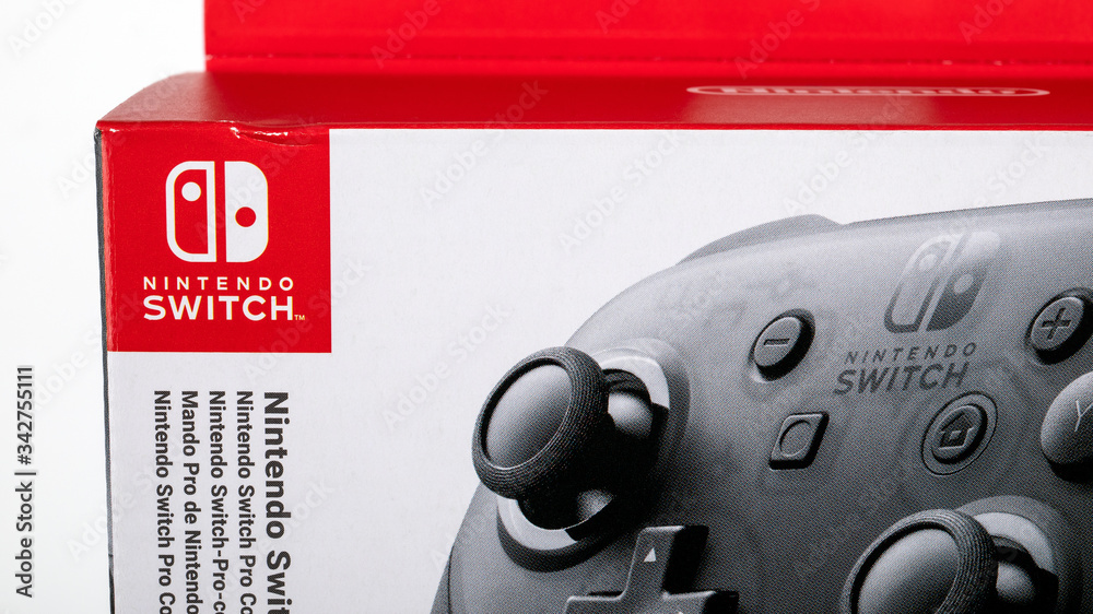 Nintendo Pro Controller in box for Nintendo Switch, black console for  gamers on white background Stock Photo | Adobe Stock