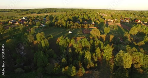 Wallpaper Mural 4K aerial late summer afternoon high quality video footage of lush green countryside forest location and white 4WD car in village outskirts in Yaroslavl region of Russia Torontodigital.ca