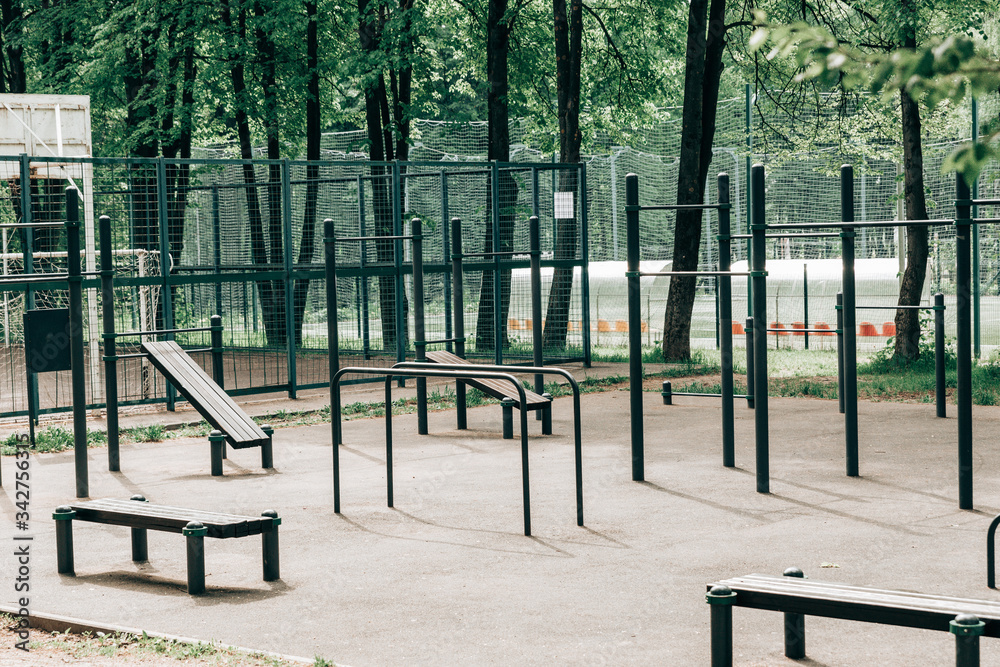 An empty training ground (workout) on the street, horizontal bars and benches for exercise on the press. An empty training ground (workout) on the street, horizontal bars and benches for exercise on the press.