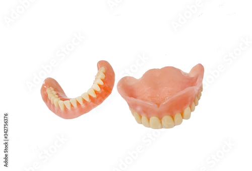 Complete full dentures isolated on white background