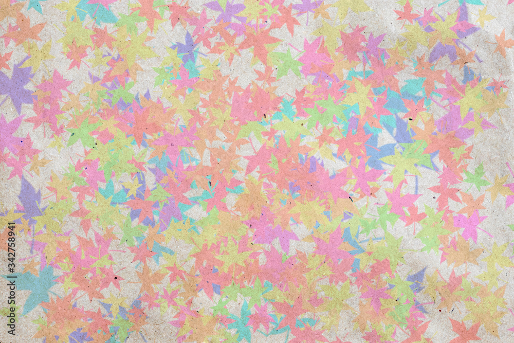 Abstract wallpaper with colorful maple leaves on craft textured paper.