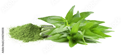 Green Kariyat herbal powder and capsule on white background top view
