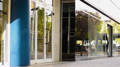 Reflection of People On Glass Building