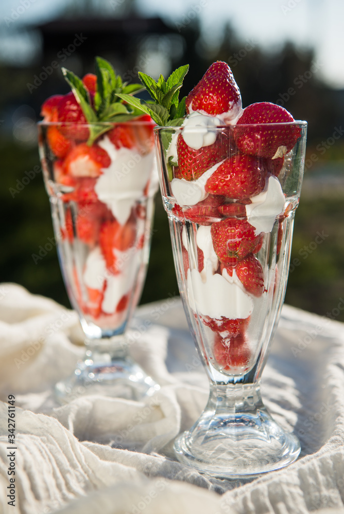 Fresh strawberries with yoghurt and whipped cream. Breakfast time. Healthy food. Delicious dessert sugar free. Vegetarian dish. Spring time Fresh strawberries with yoghurt and whipped cream. Breakfast time. Healthy food. Delicious dessert sugar free. Vegetarian dish. Spring time