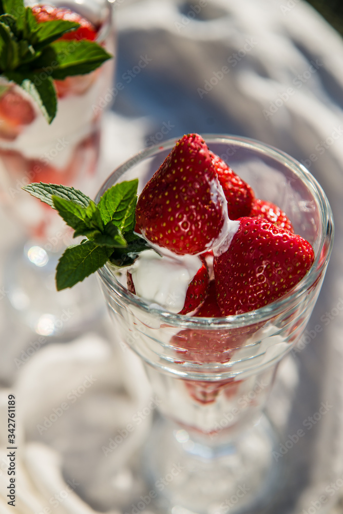 Fresh strawberries with yoghurt and whipped cream. Breakfast time. Healthy food. Delicious dessert sugar free. Vegetarian dish. Spring time Fresh strawberries with yoghurt and whipped cream. Breakfast time. Healthy food. Delicious dessert sugar free. Vegetarian dish. Spring time