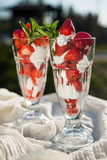 Fresh strawberries with yoghurt and whipped cream. Breakfast time. Healthy food. Delicious dessert sugar free. Vegetarian dish. Spring time 