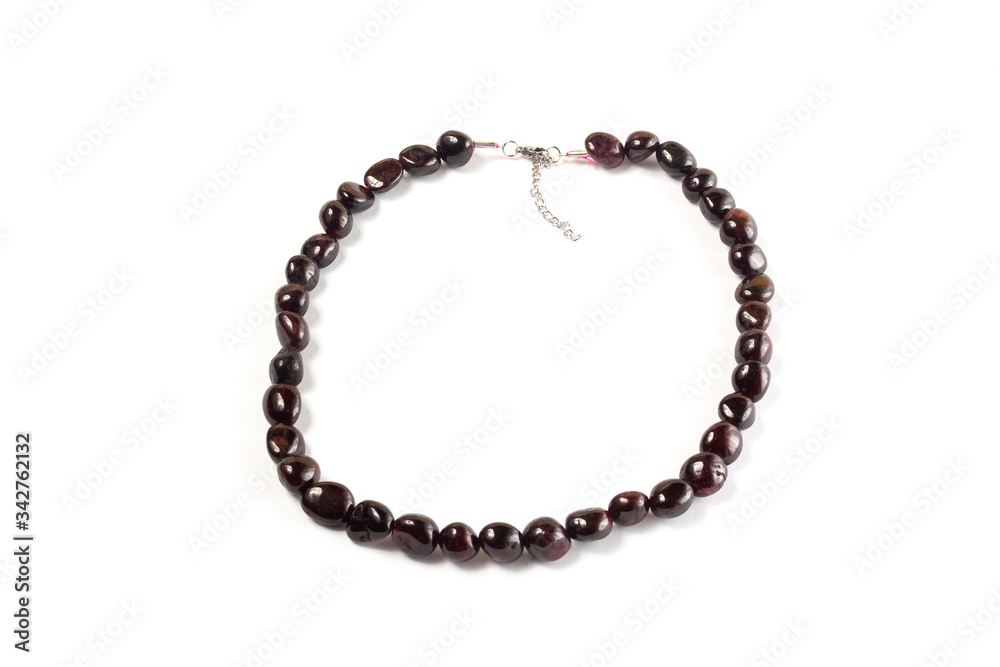 Natural pomegranate beads on a white background isolate Natural pomegranate beads on a white background isolate
