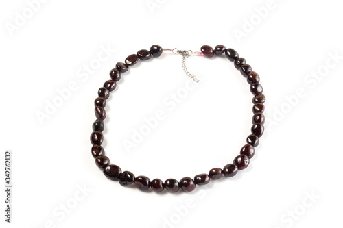 Natural pomegranate beads on a white background isolate