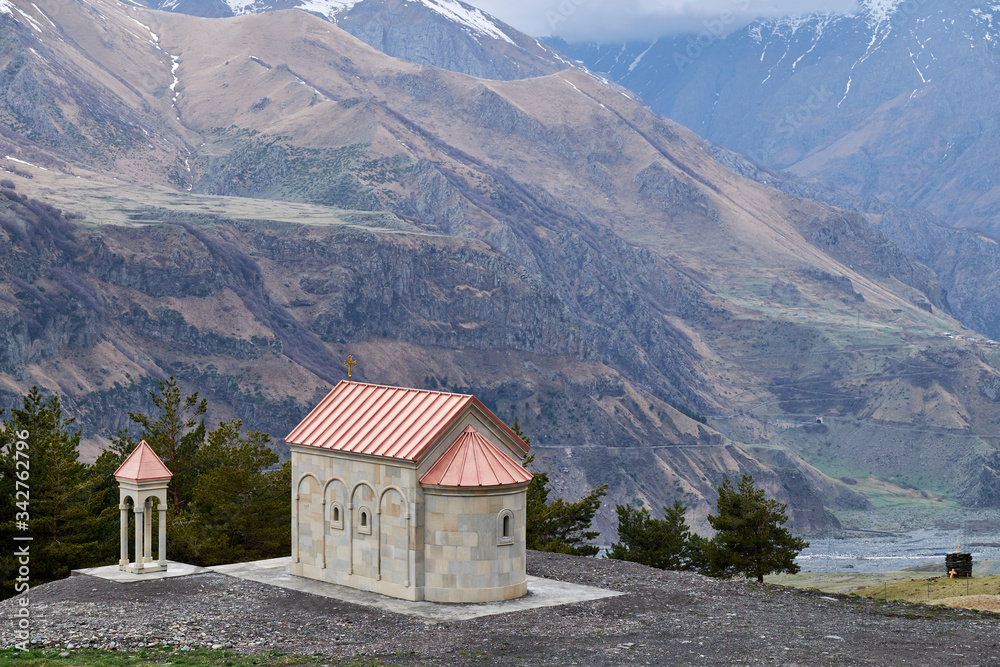 Beautiful scenery of Kazbegi valley view from Ioane Natlismcemeli church, Caucasus mountain range in Georgia
