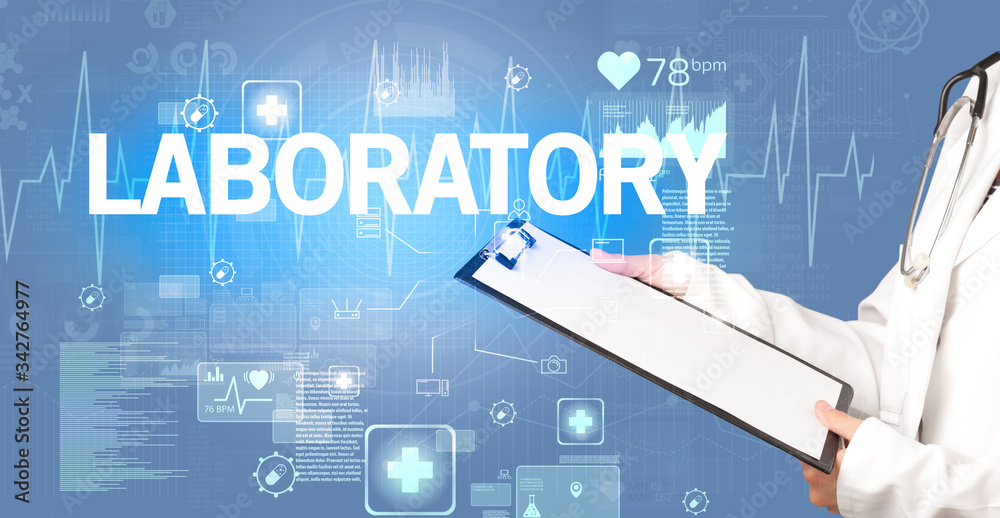young doctor writing down notes with LABORATORY inscription, healthcare concept young doctor writing down notes with LABORATORY inscription, healthcare concept
