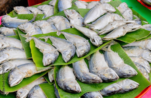 Mackerel fish for sellon the banana leaves which help decreasing fish's smell smell. photo