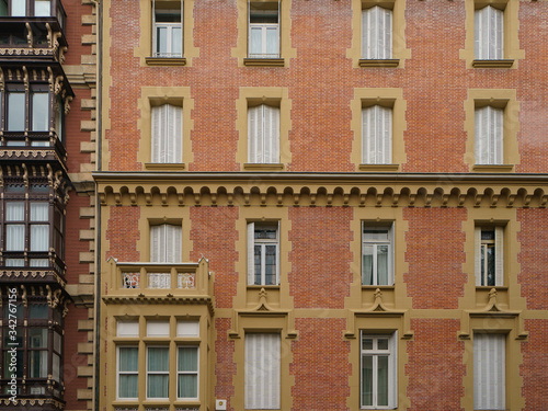 Facade of the traditional spahish residential building. Domestic life concept. Basque country.