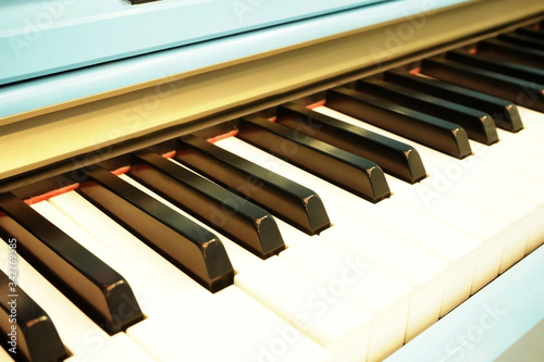 Close up shot of retro piano keys. Pastel color.