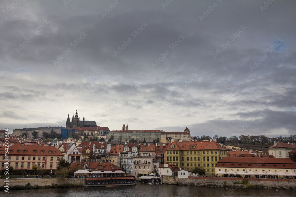 Panorama of the Old Town of Prague, Czech Republic, in autumn, at fall, with Hradcany hill and the Prague Castle with the St Vitus Cathedral (Prazsky hill) seen from Vltava river. 