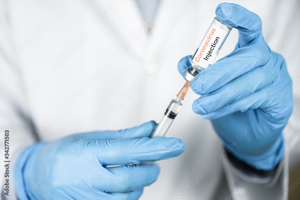 Doctor or nurse hand holding coronavirus vaccine, covid-19 medicine for people immunization, health care concept (select focus) Doctor or nurse hand holding coronavirus vaccine, covid-19 medicine for people immunization, health care concept (select focus)