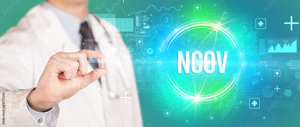 Close-up of a doctor giving you a pill with nCOV abbreviation, virology concept Close-up of a doctor giving you a pill with nCOV abbreviation, virology concept