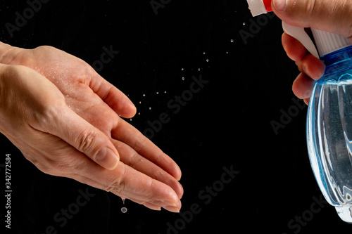 Hand treatment with an antiseptic to protect against viruses.
