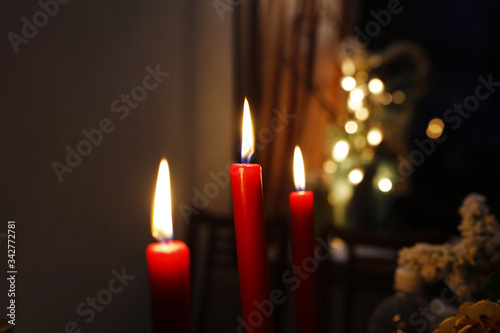 Three candles for a romantic dinner in the evening