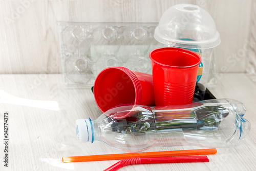 Plastic waste after use at home, ecology environmental pollution by garbage, copy space for text
