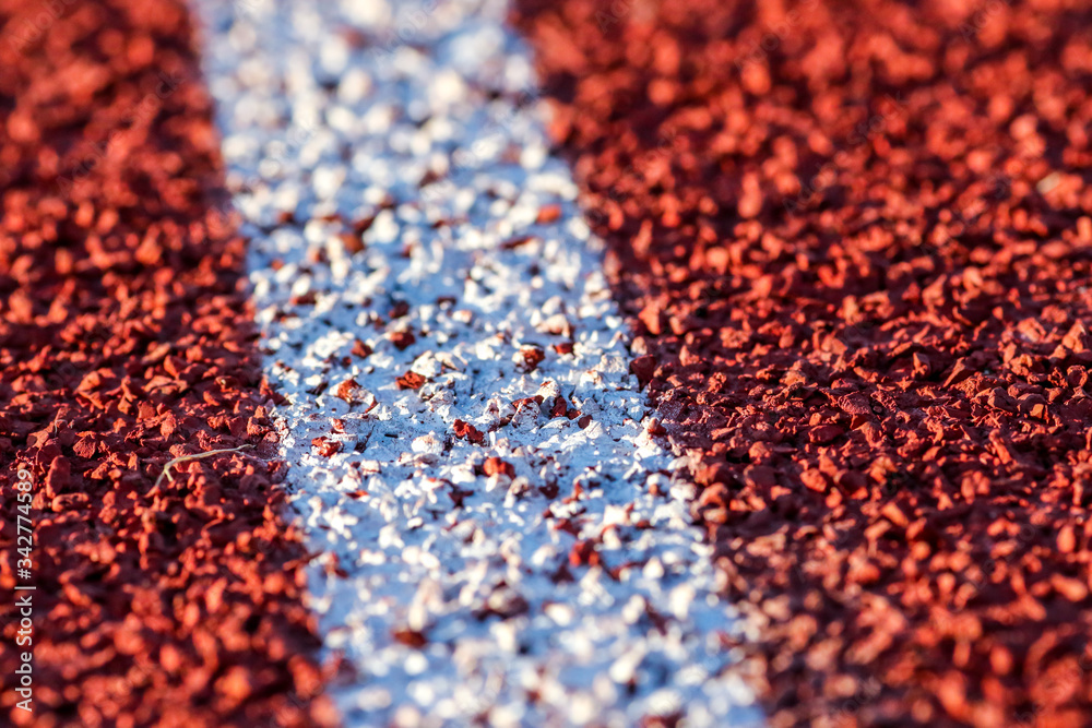 Red running sport track background and texture. Sport running track concept. Red running sport track background and texture. Sport running track concept.