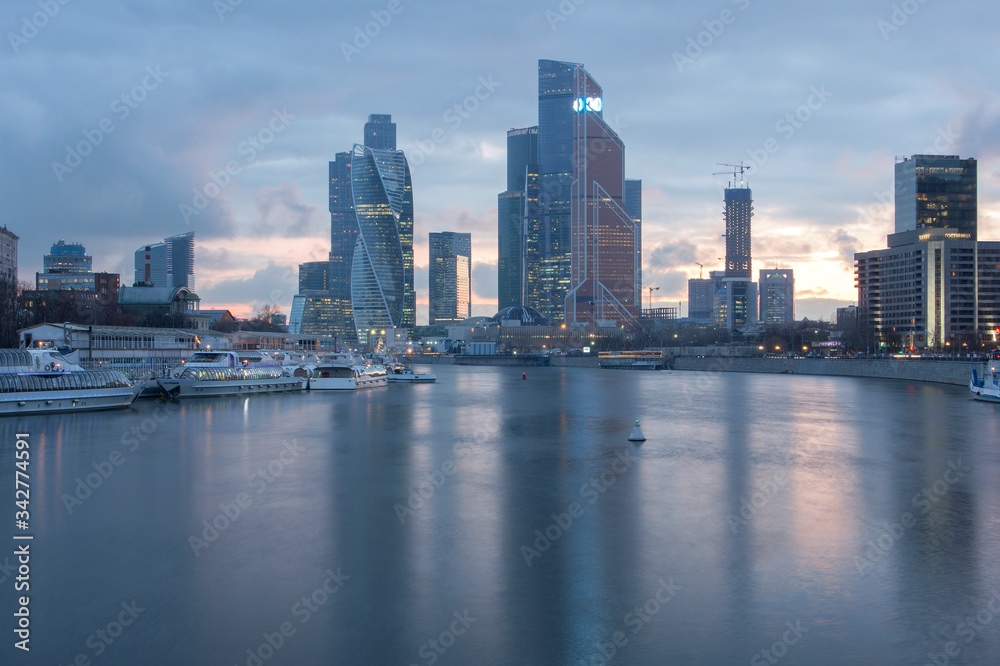 Moscow’s skyscraper district at sunset. High-rise buildings. Reflections in water. Moscow City.