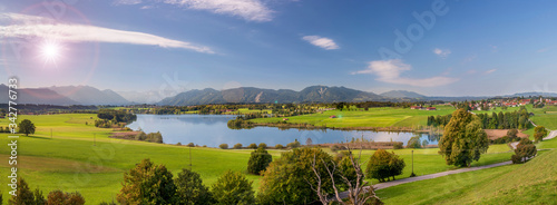 panoramic scene in Bavaria with lake and mountain range