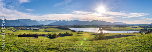 panoramic scene at Bavarian alps mountain range and lake Riegsee