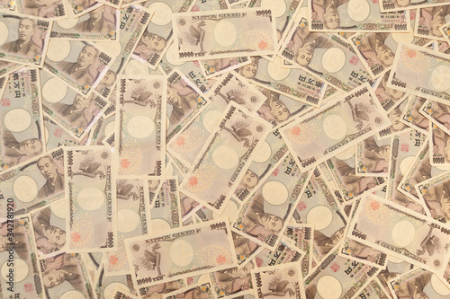 10 000 yen notes - Background with several 10 000 yen notes  front and back . Japanese money. Concept  financial abundance. Horizontal shot.