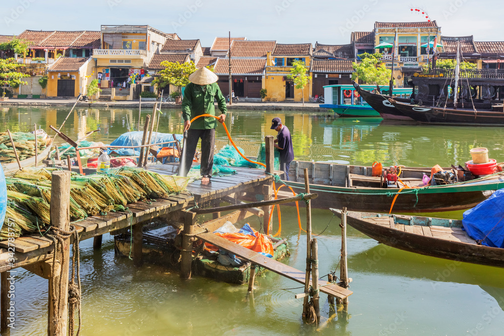 Obraz premium Panorama Aerial view of Hoi An ancient town, UNESCO world heritage, at Quang Nam province. Vietnam. Hoi An is one of the most popular destinations in Vietnam. Boat on Hoai river
