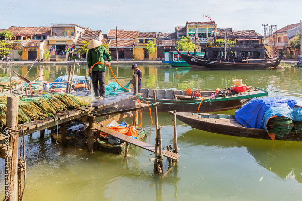 Obraz premium Panorama Aerial view of Hoi An ancient town, UNESCO world heritage, at Quang Nam province. Vietnam. Hoi An is one of the most popular destinations in Vietnam. Boat on Hoai river