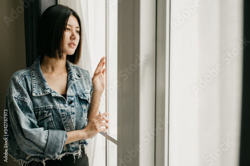 Free Download Lockdown concept Beautiful Girls Teenage look In the house window Do not leave the house Sad Prevention of viral diseases Covid 19 - GFXLoad