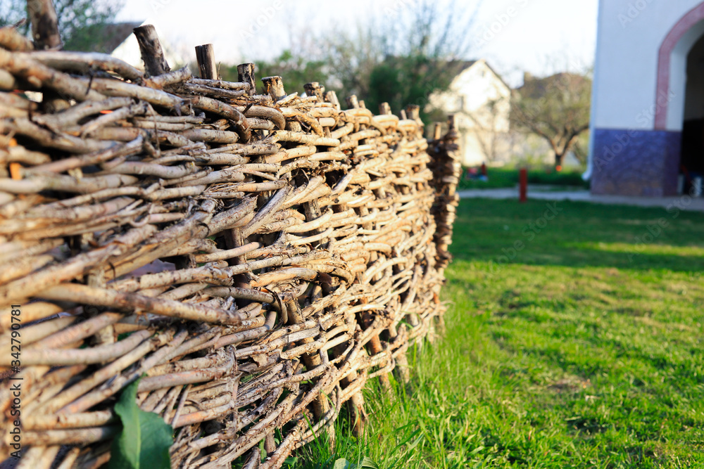 wattle old dry woven of gray branches as a fence wattle old dry woven of gray branches as a fence