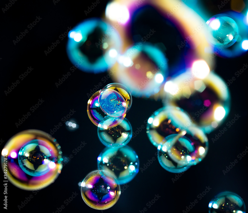 colorful soap bubbles float on the dark, bubbles abstract background colorful soap bubbles float on the dark, bubbles abstract background