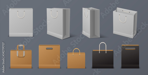 Realistic paper bag. Blank reusable shopping white and black bag with handles isolated on gray background. Vector 3D craft merchandise designs pack for merchandising and advertising