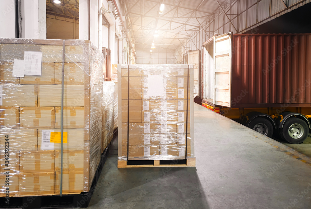 Packaging Boxes Wrapped Plastic on Pallets Loading into Cargo Container