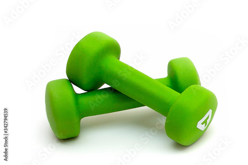 bright green sports dumbbells isolated on a white background