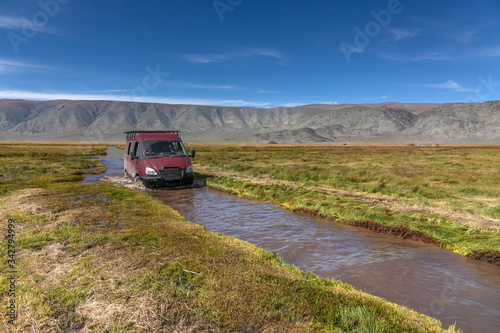 Journey of river on SUV car. Mongolia - Altai. photo made from inside car © Tatiana