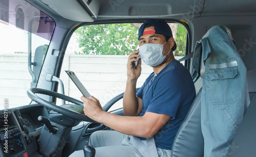 Truck driver wearing a mask