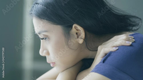 Wallpaper Mural Young pensive woman looks unhealthy near window Torontodigital.ca