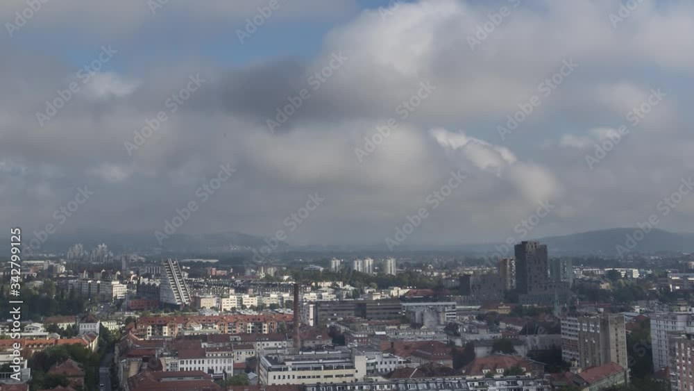 Zoom out time lapse clouds moving over Ljubljana city, Slovenia Zoom out time lapse clouds moving over Ljubljana city, Slovenia